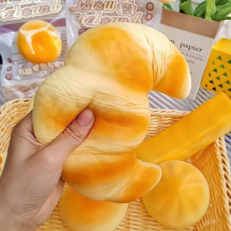 Croissant-Squishy-Stressball – Weiches Klebriges Slow-Rising Brot-Knautsch-, Fidget- & Sensorikspielzeug für Entspannung & Partygeschenke